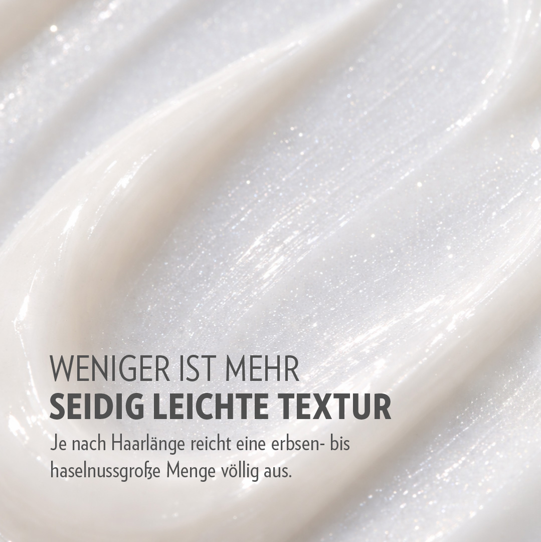 Textur der GLYNT MALIBU Anti Frizz Creme in Nahaufnahme, cremige Konsistenz mit feinem Glanz.