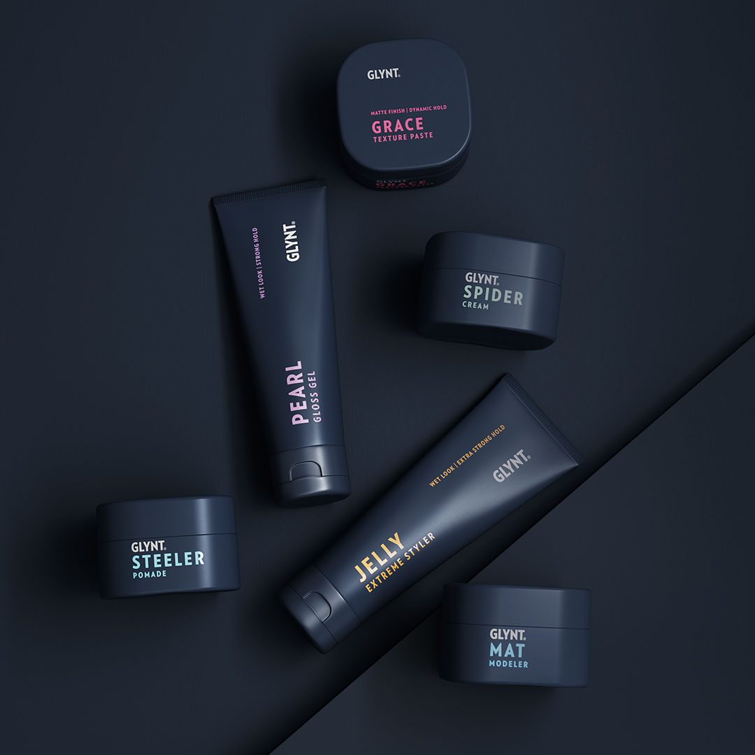 GLYNT Style Effect Stylingprodukte auf dunkelblauem Hintergrund 