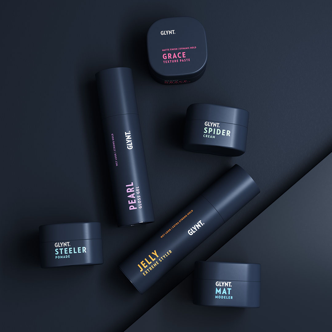 Alle Produkte der STYLE EFFECT Serie von GLYNT liegen auf dunkelblauem Untergrund